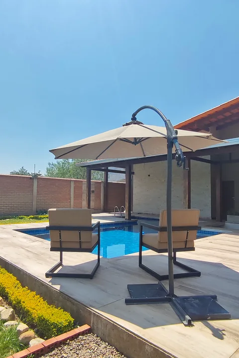Seating and a parasol beside the pool